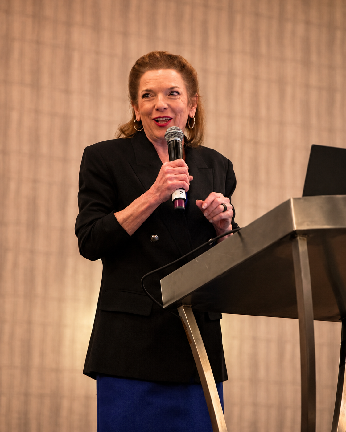 Dr. Gina Pritchard presenting to a conference audience